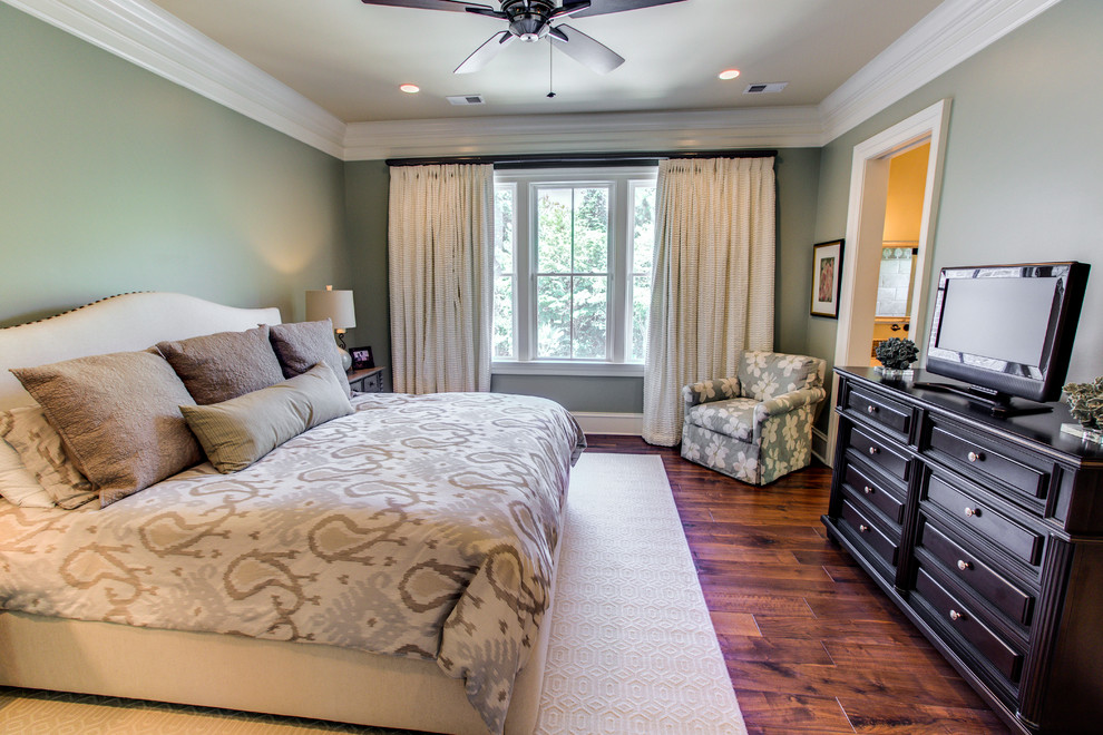 Design ideas for a mid-sized traditional guest bedroom in Charleston with green walls, medium hardwood floors and no fireplace.