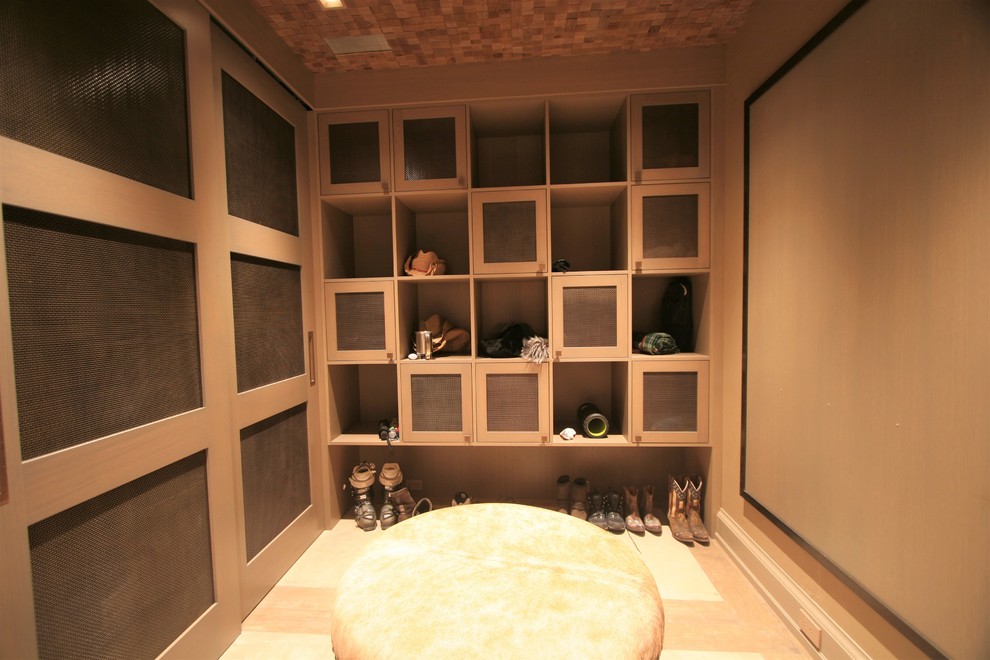 Photo of a mid-sized modern mudroom in Denver with beige walls and light hardwood floors.