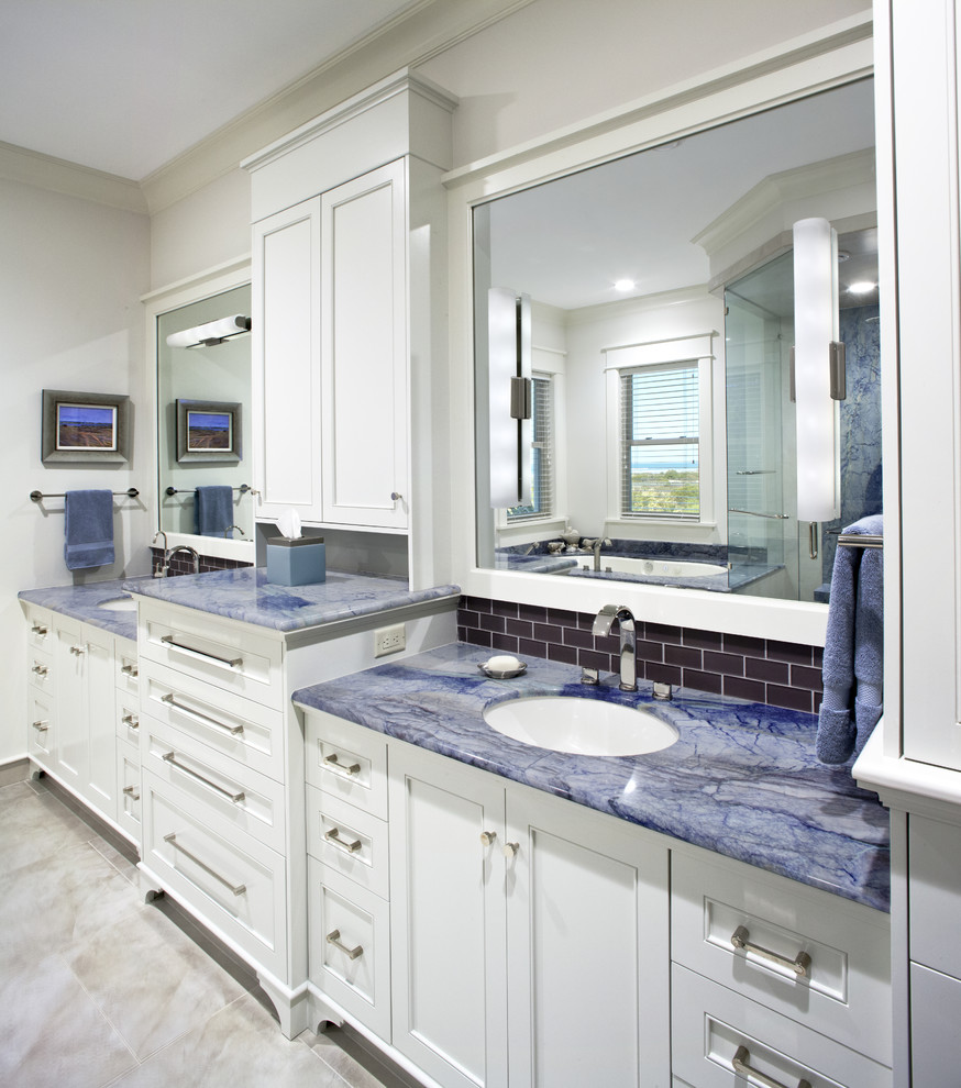 Inspiration for a beach style bathroom in Jacksonville with blue benchtops.