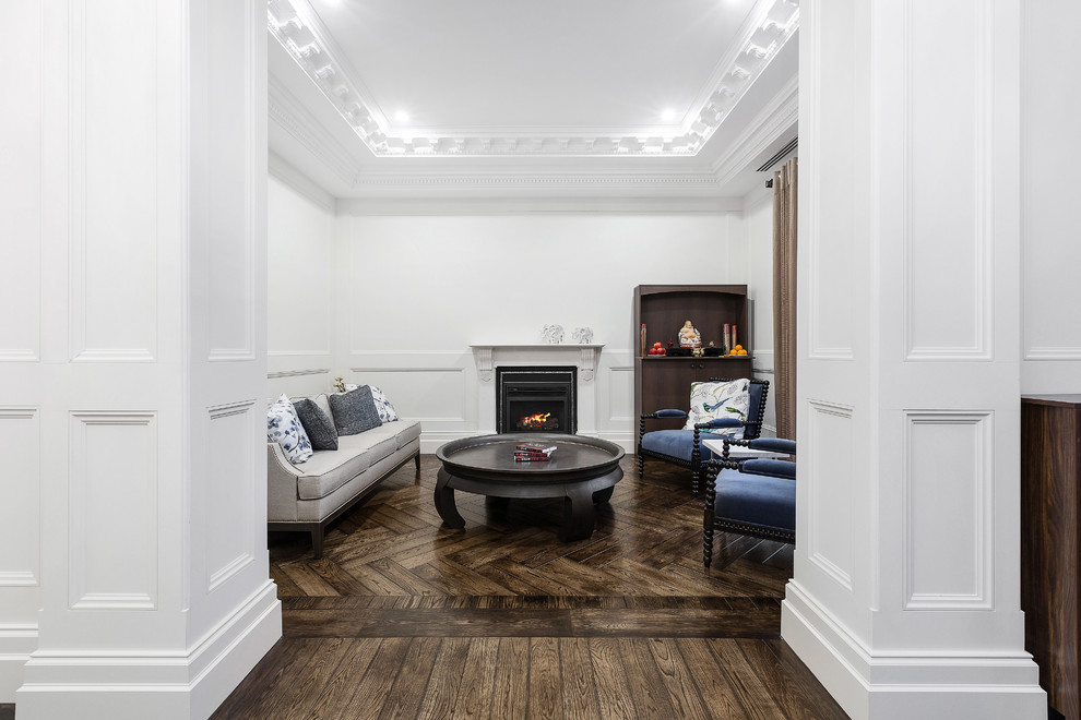 This is an example of a large traditional formal open concept living room in Melbourne with white walls, dark hardwood floors, a standard fireplace, a plaster fireplace surround, no tv and brown floor.