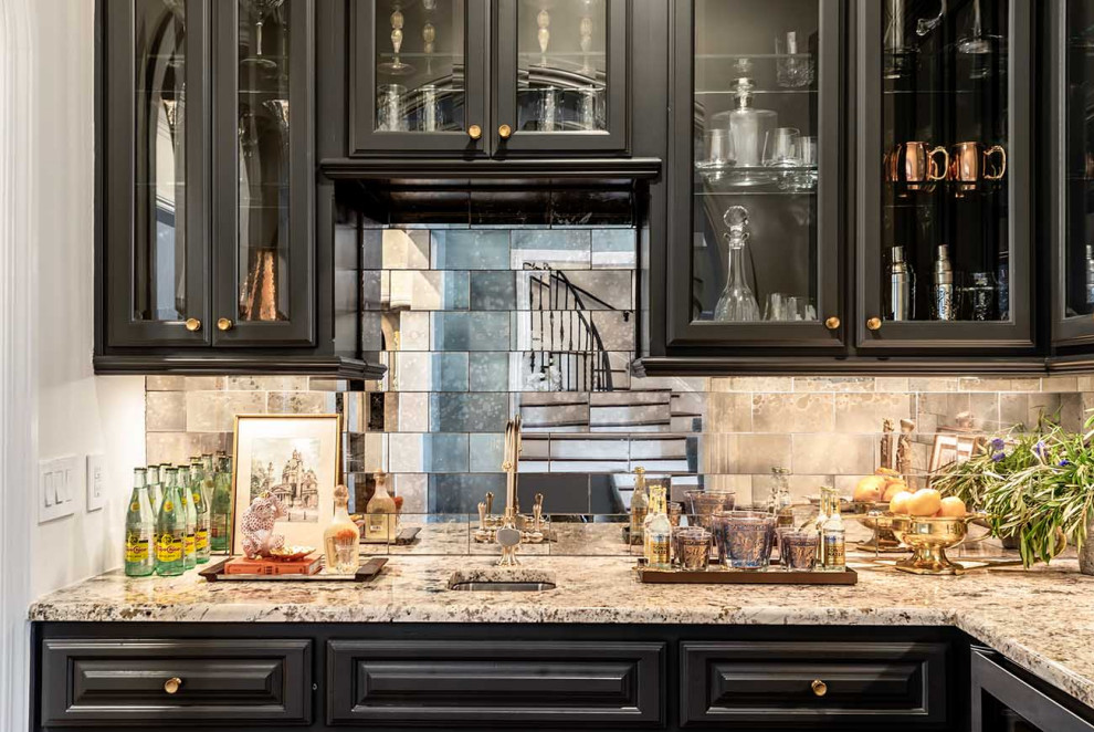 Design ideas for a large transitional l-shaped wet bar in Austin with an undermount sink, recessed-panel cabinets, black cabinets, granite benchtops, mirror splashback and dark hardwood floors.