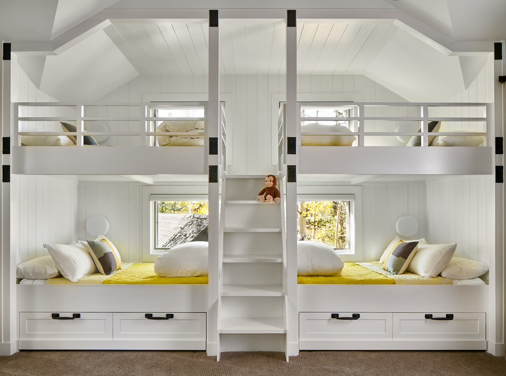 Photo of a mid-sized country gender-neutral kids' bedroom for kids 4-10 years old in Denver with white walls, carpet and grey floor.