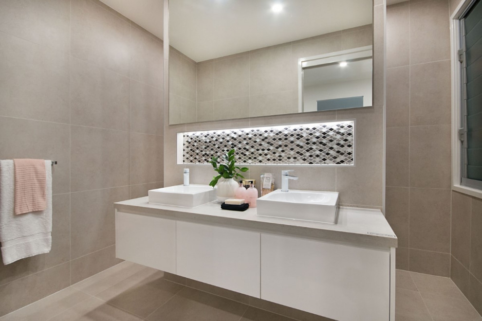Mid-sized contemporary 3/4 bathroom in Gold Coast - Tweed with flat-panel cabinets, white cabinets, gray tile, porcelain tile, porcelain floors, a vessel sink, beige floor, grey benchtops and a niche.
