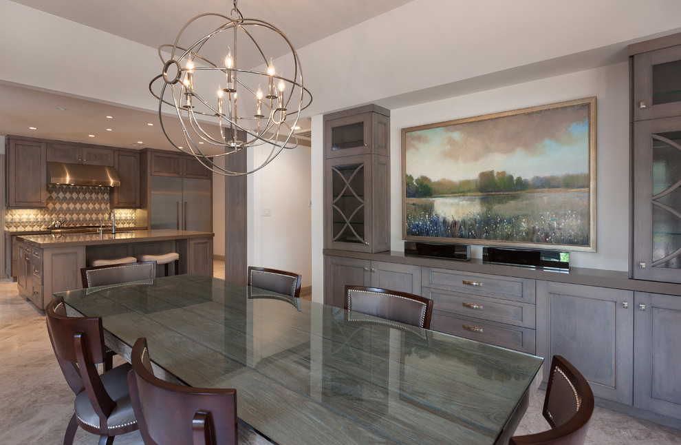 Example of a large transitional limestone floor kitchen/dining room combo design in Houston with white walls and no fireplace