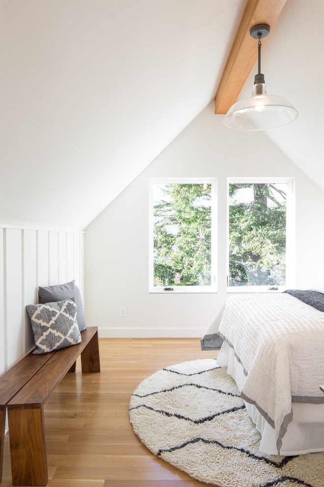 Design ideas for a transitional bedroom in Seattle with white walls, light hardwood floors and beige floor.