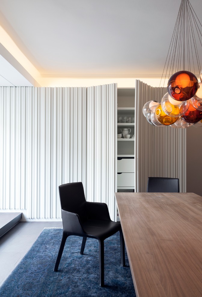 Design ideas for a contemporary dining room in Munich with white walls.