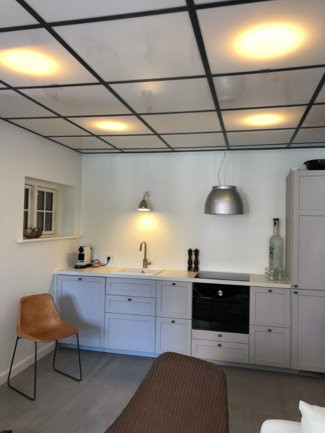 Small danish single-wall cement tile floor, gray floor and coffered ceiling eat-in kitchen photo in Copenhagen with a single-bowl sink, raised-panel cabinets, gray cabinets, quartz countertops, black appliances and white countertops