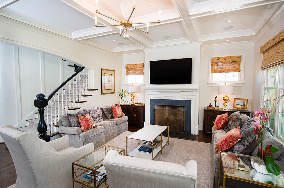 Traditional enclosed family room in Raleigh with white walls, dark hardwood floors, a standard fireplace, a stone fireplace surround, a wall-mounted tv and brown floor.