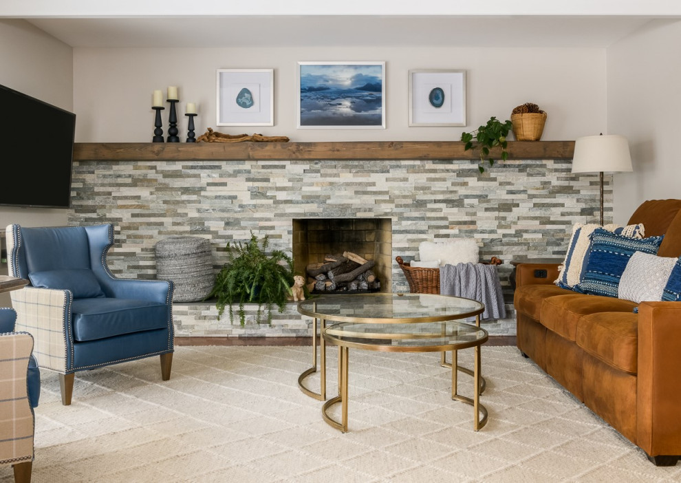 Inspiration for a mid-sized transitional open concept medium tone wood floor, brown floor and exposed beam living room remodel in Philadelphia with a standard fireplace and a stacked stone fireplace