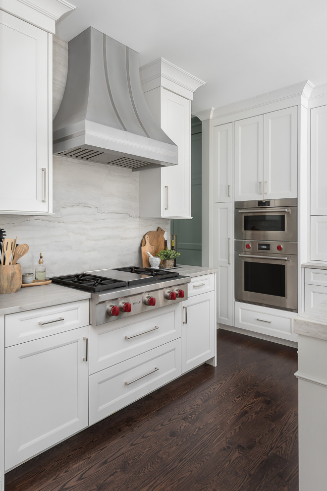 Inspiration for a large transitional u-shaped eat-in kitchen in Chicago with recessed-panel cabinets, white cabinets, quartzite benchtops and with island.