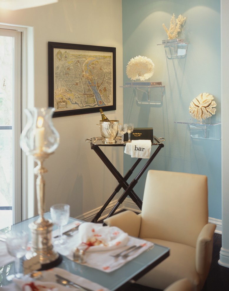 Inspiration for a beach style dining room in Los Angeles with blue walls.