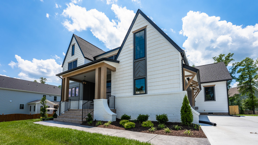 The Cardinal - Large transitional white three-story gable roof photo in Richmond with a mixed material roof and a black roof