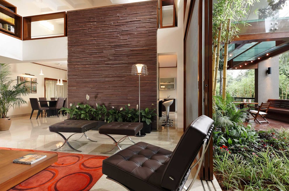 Design ideas for a contemporary open concept living room in Bengaluru.