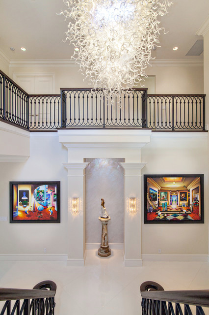 Photo of a large eclectic foyer in Miami with marble floors, a double front door and a glass front door.