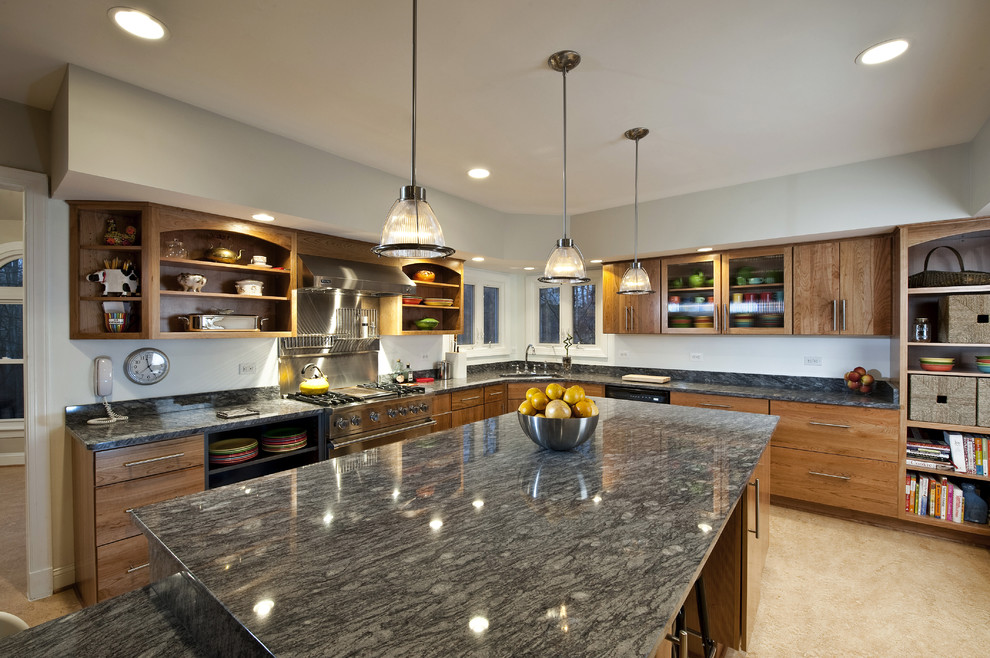 This is an example of a mid-sized contemporary l-shaped open plan kitchen in DC Metro with granite benchtops, an undermount sink, flat-panel cabinets, medium wood cabinets, stainless steel appliances, linoleum floors and with island.