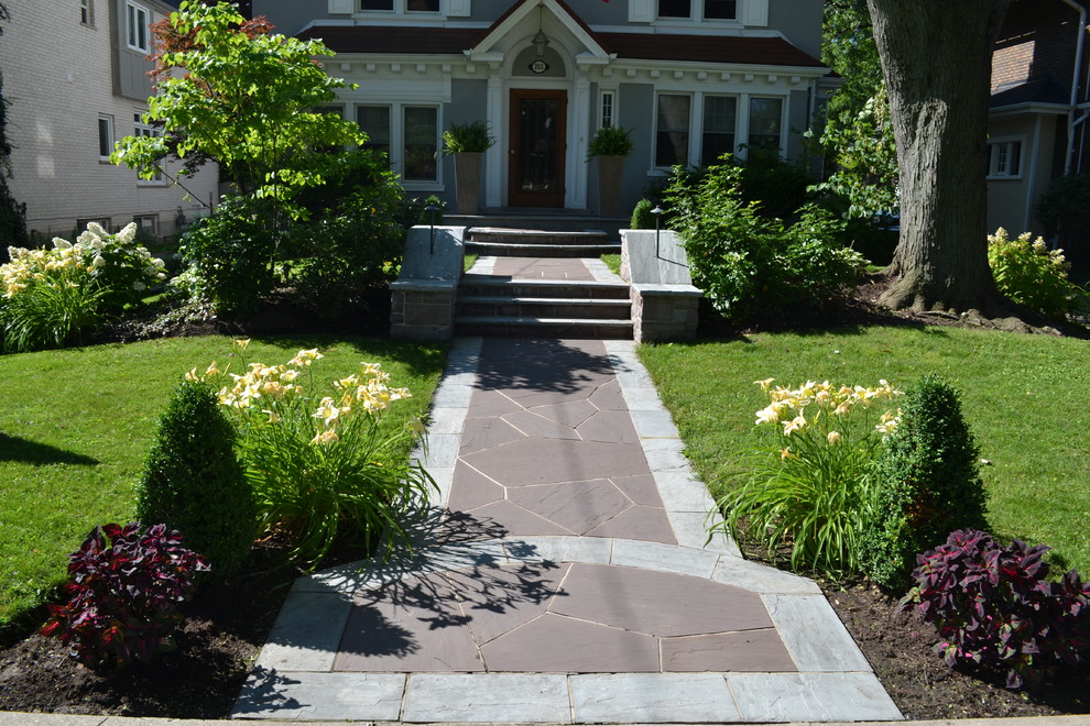 Mid-sized contemporary front yard partial sun garden in Toronto with a garden path and natural stone pavers for summer.