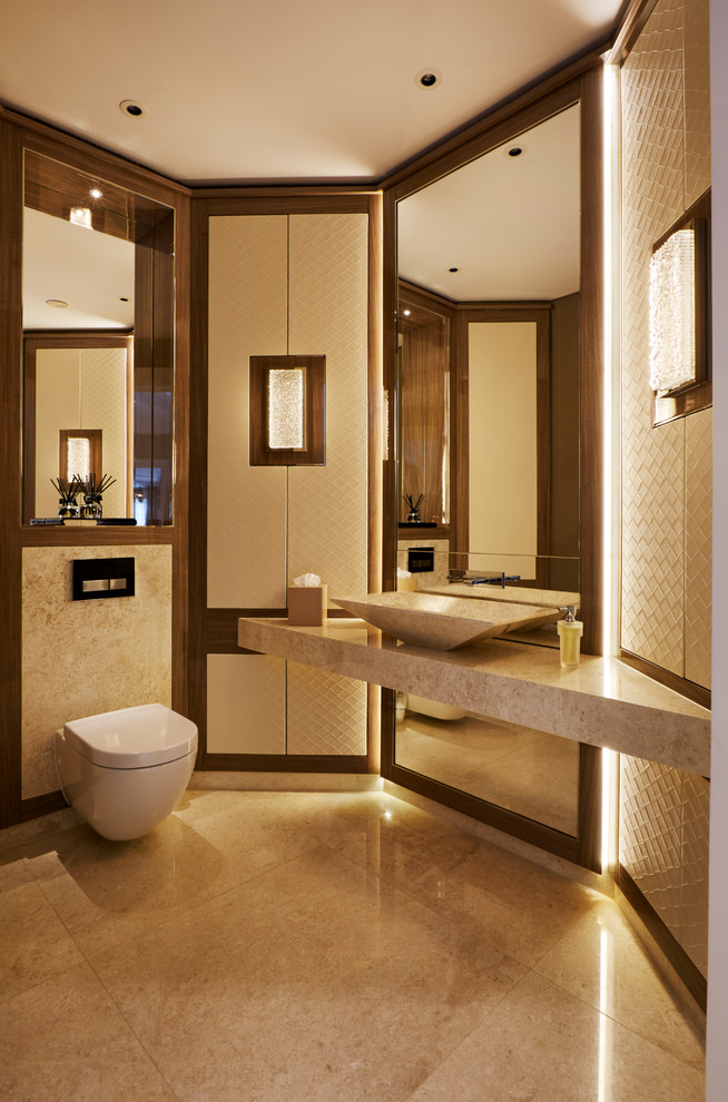 This is an example of a contemporary bathroom in London with a vessel sink and a wall-mount toilet.