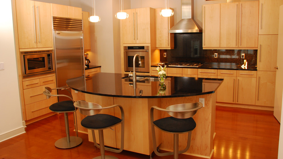 Open concept kitchen - large contemporary medium tone wood floor open concept kitchen idea in Atlanta with a drop-in sink, light wood cabinets, granite countertops, black backsplash, glass tile backsplash, stainless steel appliances and an island