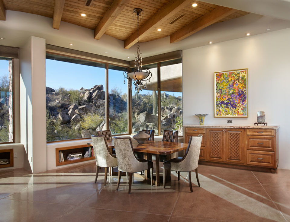 Photo of a dining room in Phoenix with concrete floors.