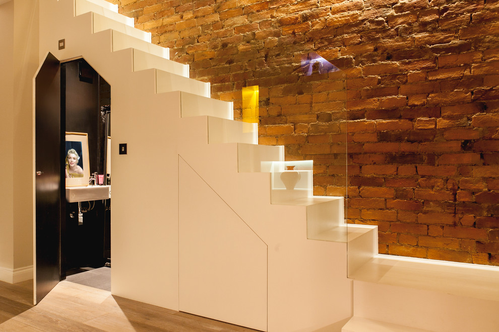 This is an example of a mid-sized contemporary straight staircase in Other.