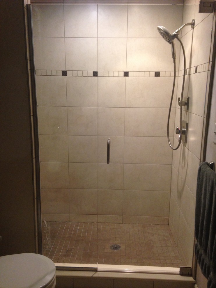 Inspiration for a transitional 3/4 beige tile and ceramic tile ceramic tile and beige floor alcove shower remodel with beige walls and a hinged shower door
