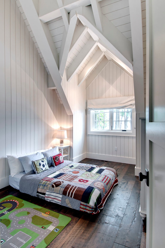 Photo of a beach style kids' room for boys in Toronto with white walls and dark hardwood floors.