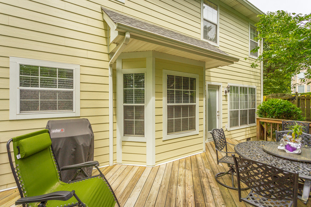 Photo of a mid-sized traditional side yard deck in Other with no cover.
