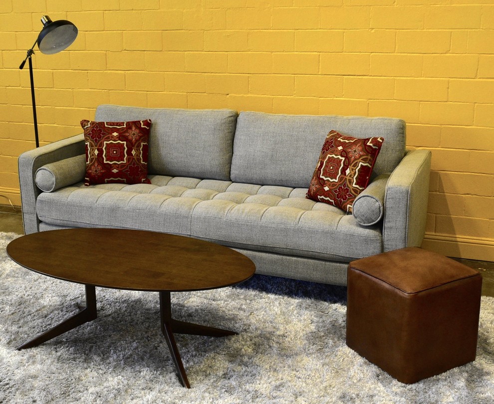 This is an example of a mid-sized midcentury formal enclosed living room in Houston with yellow walls and carpet.