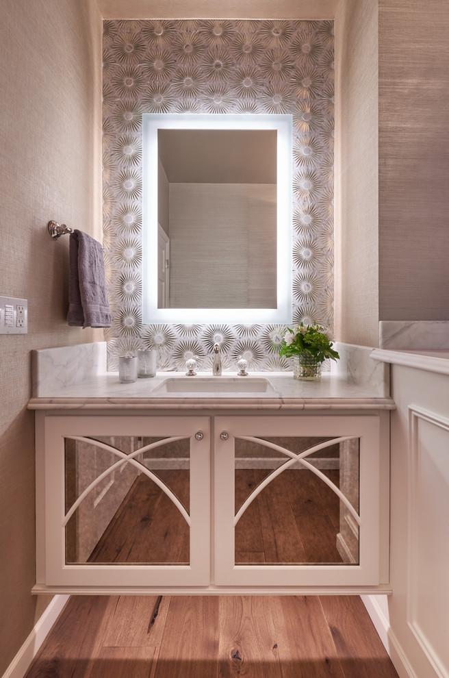 Mid-sized contemporary powder room in Seattle with grey walls, medium hardwood floors and an undermount sink.