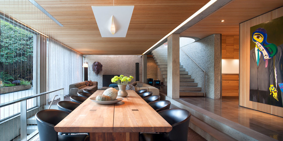 This is an example of a contemporary open plan dining in Vancouver.