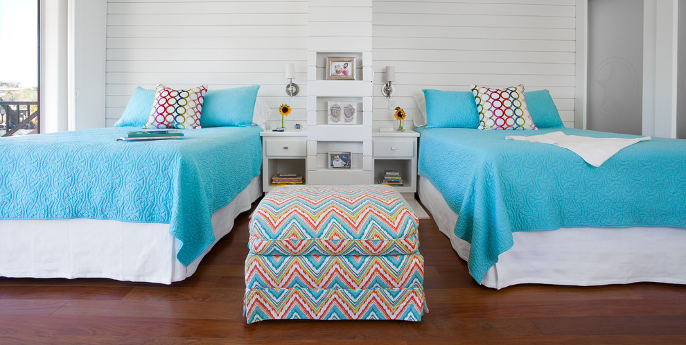 Inspiration for a mid-sized beach style kids' room for girls in Austin with white walls and medium hardwood floors.