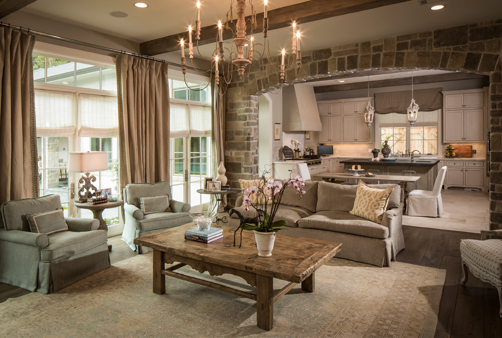 Photo of a mid-sized traditional enclosed family room in Houston with beige walls, dark hardwood floors, no fireplace and brown floor.