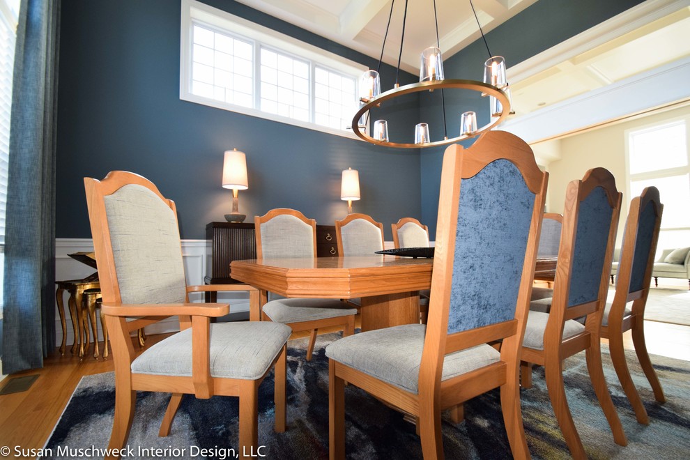 Enclosed dining room - mid-sized transitional light wood floor enclosed dining room idea with blue walls
