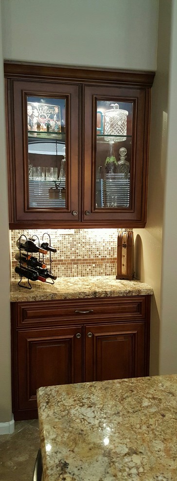 Eat-in kitchen - transitional single-wall eat-in kitchen idea in Phoenix with an undermount sink, dark wood cabinets, granite countertops, brown backsplash, glass tile backsplash, stainless steel appliances and an island