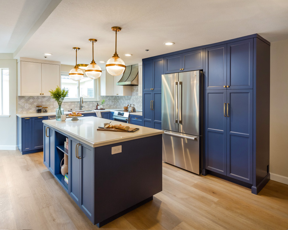 Inspiration for a mid-sized transitional l-shaped kitchen pantry in San Francisco with quartz benchtops, multi-coloured splashback, stainless steel appliances, with island and blue benchtop.