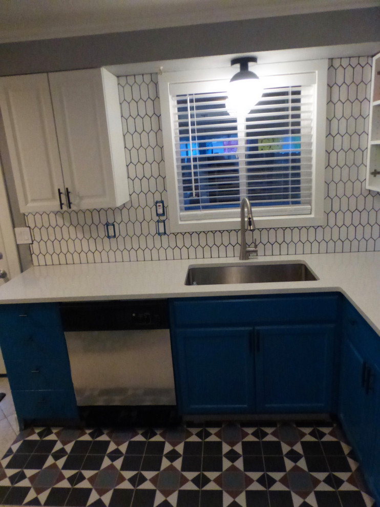 Kitchen - kitchen idea in Boise with blue cabinets, quartz countertops, white backsplash, ceramic backsplash and white countertops