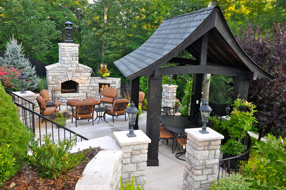 Inspiration for a traditional patio in Cincinnati with a fire feature and a gazebo/cabana.