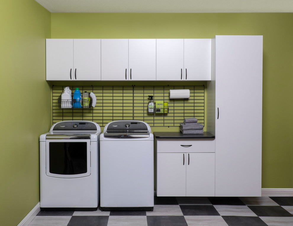 Photo of a mid-sized modern single-wall utility room in Toronto with flat-panel cabinets and white cabinets.