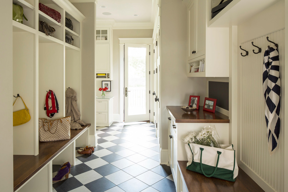 Photo of a transitional mudroom in Minneapolis with ceramic floors and multi-coloured floor.