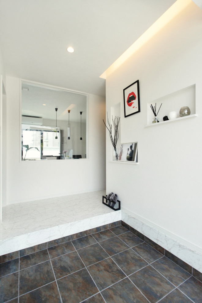 Photo of a contemporary entryway in Other with white walls, black floor, a double front door and a black front door.