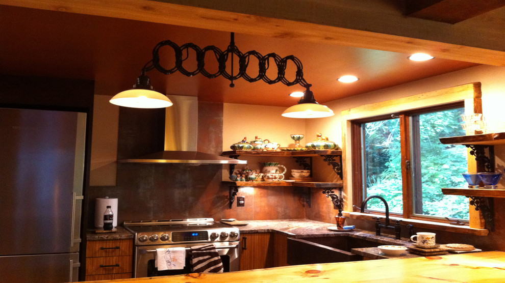 Mid-sized mountain style kitchen photo with medium tone wood cabinets, wood countertops, metallic backsplash and an island