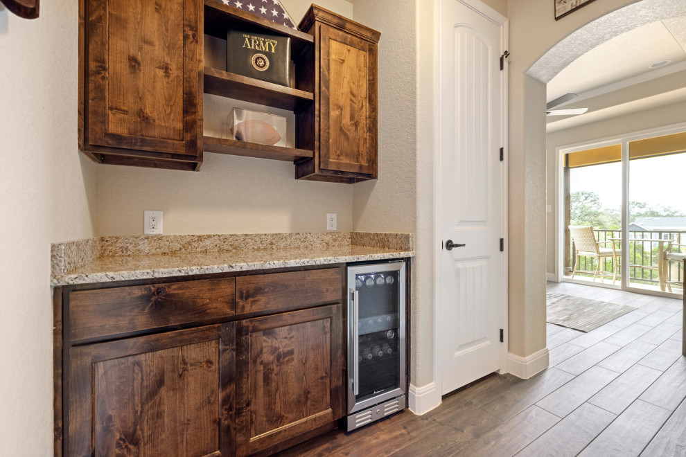 Inspiration for a transitional home bar remodel in Austin