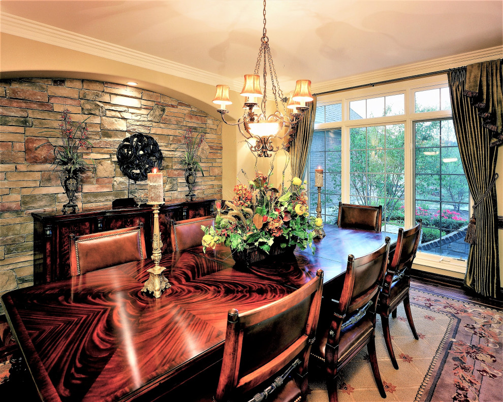 Design ideas for a large traditional separate dining room with black walls, dark hardwood floors and no fireplace.