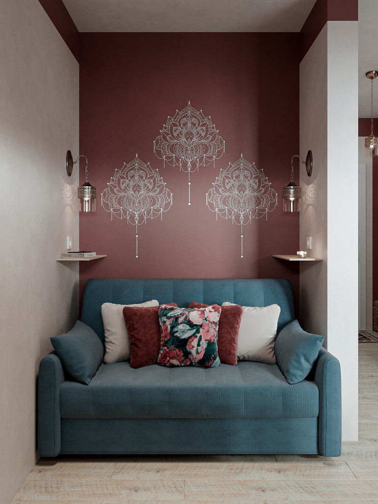 Esempio di un piccolo soggiorno design con pareti beige, pavimento in laminato e TV autoportante