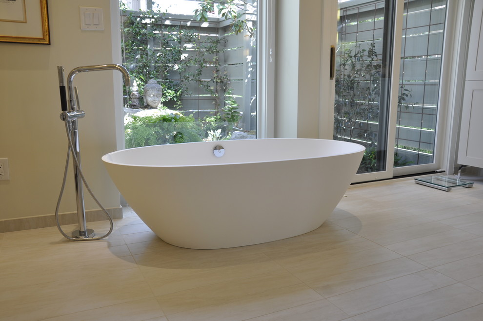 Inspiration for an expansive contemporary master bathroom in Seattle with shaker cabinets, purple cabinets, an undermount tub, an alcove shower, a one-piece toilet, porcelain tile, yellow walls, porcelain floors, an undermount sink, quartzite benchtops, beige floor, a sliding shower screen, yellow tile and beige benchtops.