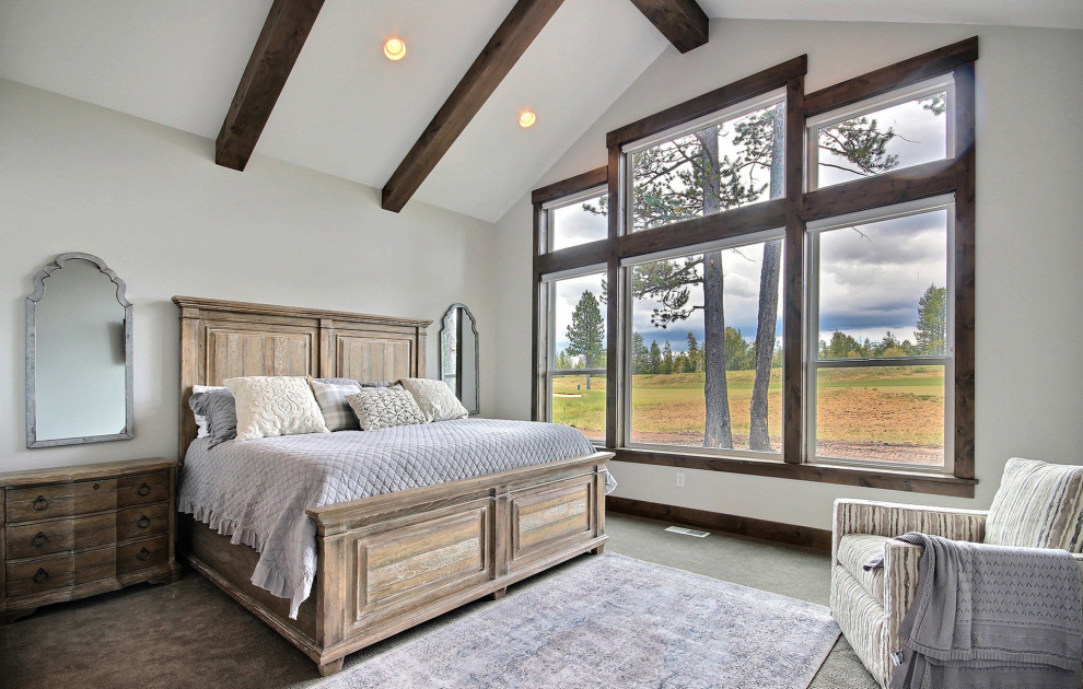 Design ideas for a large arts and crafts master bedroom in Portland with beige walls, carpet, no fireplace, brown floor and vaulted.