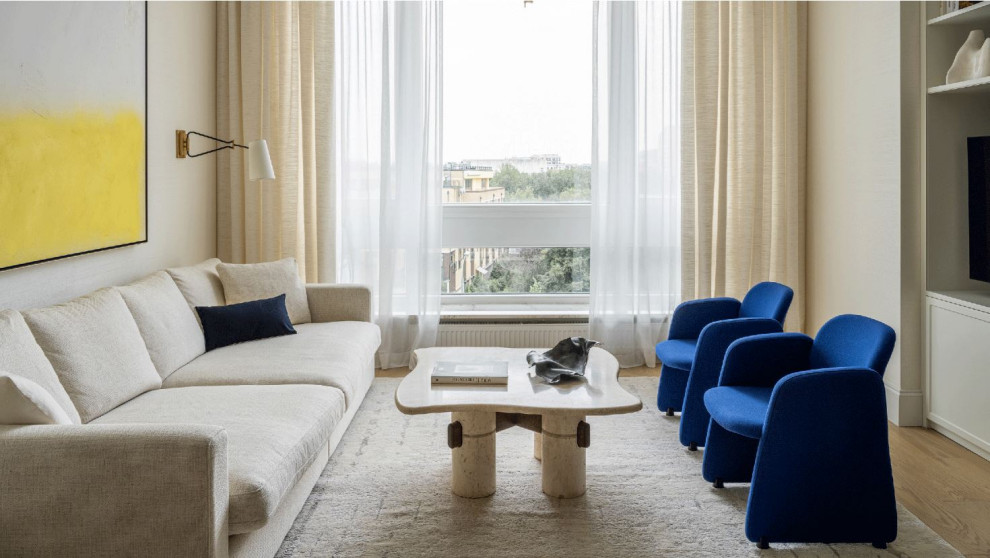 Esempio di un soggiorno contemporaneo di medie dimensioni e chiuso con pareti beige e pavimento beige