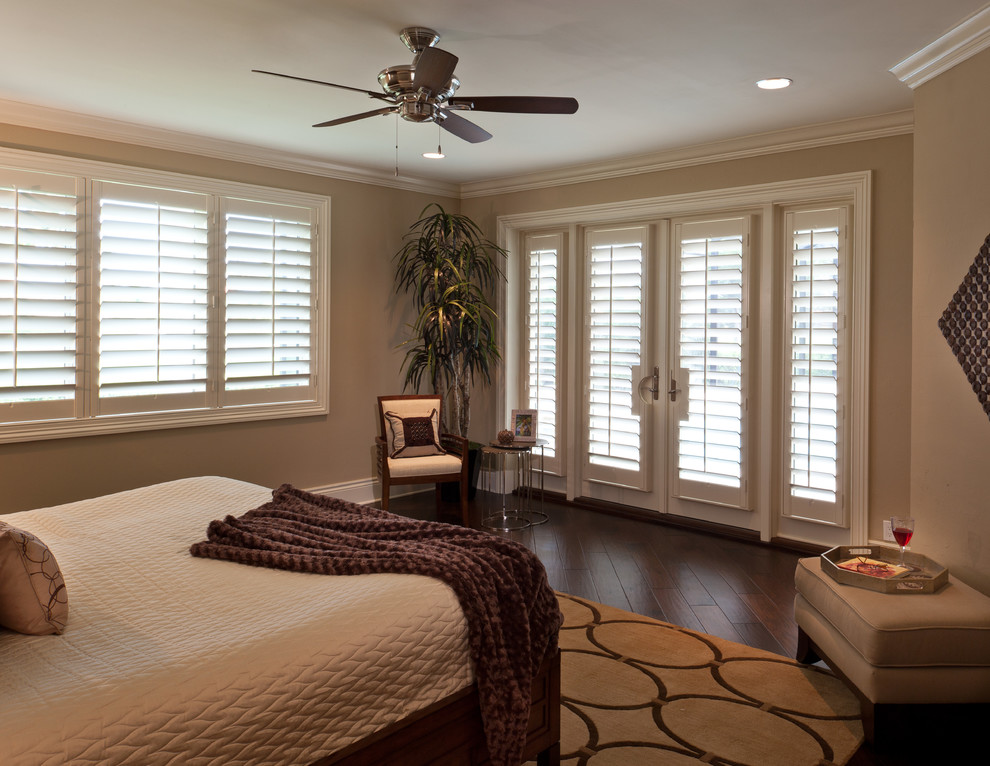 Design ideas for a large transitional master bedroom in Miami with beige walls and dark hardwood floors.