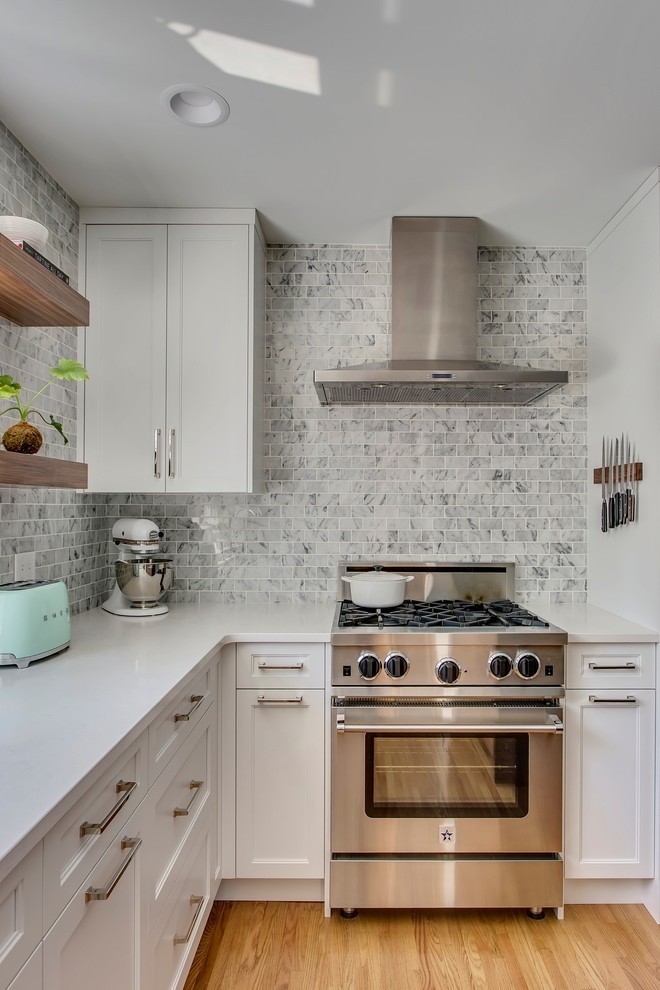 Example of a transitional kitchen design in Calgary