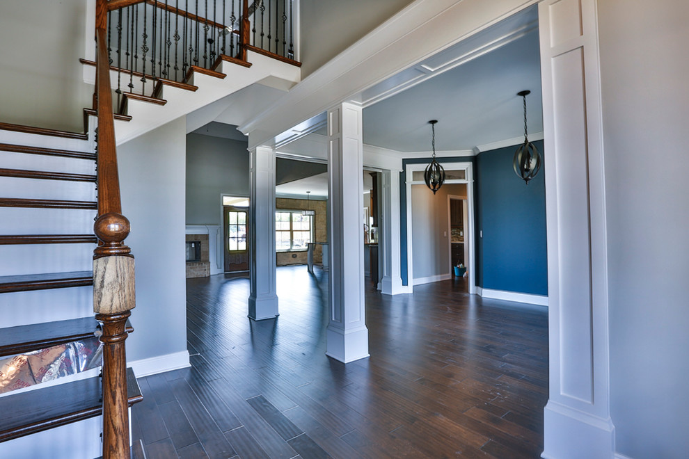 This is an example of a mid-sized modern foyer in Nashville with blue walls and medium hardwood floors.
